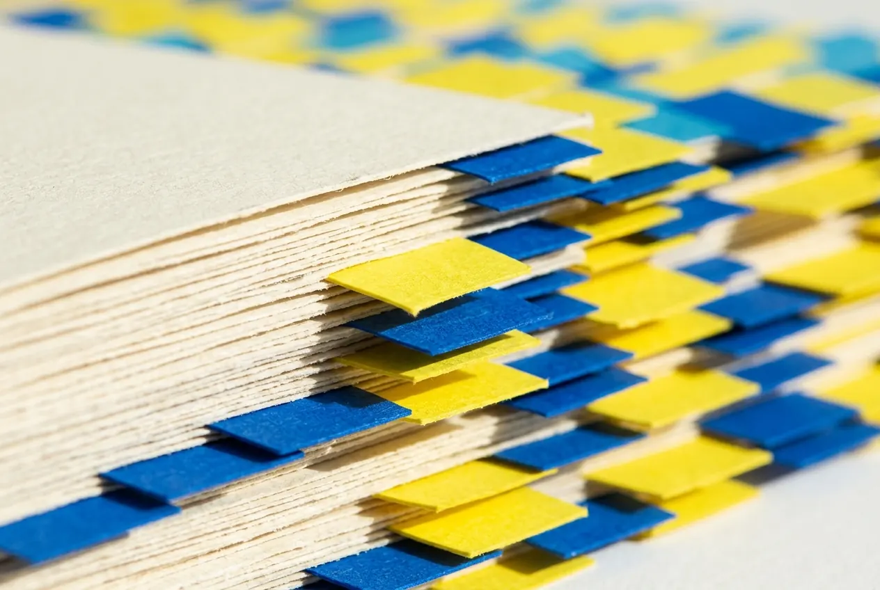 Blue and yellow index tabs marking the edges of a card stack